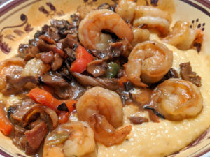What makes this the best shrimp and grits recipe ever? Bacon, mushrooms, jalepenos, and creamy grits studded with cheese!